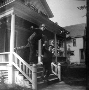 Male roomers on the porch of their house. President Little's survey of rooming house life found (to no one's surprise) that such houses were 'often of a non-intellectual character.'