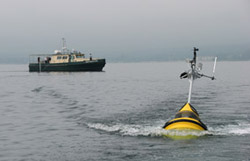 A new environmental monitoring buoy for the Upper Great Lakes Observing System will help researchers at U-M track pollution in Lake Michigan's bays. It is one of 350 inventions by U-M researchers in the past year alone—a new record. (Photo: Guy Meadows.)