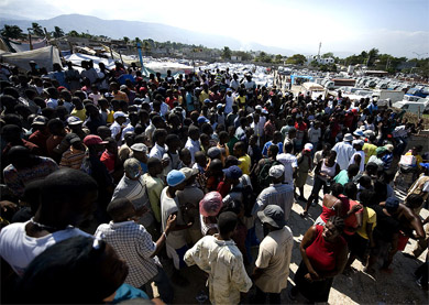 Haitian earthquake survivors gather at a Red Cross distribution site in Port-au-Prince, Haiti, to receive non-perishable supplies Jan. 25, 2010. Thousands of Haitians are homeless and lack daily necessities such as soap and blankets; help for earthquake victims was slow to arrive for several reasons. (Photo: MC1 Joshua Lee Kelsey, USN.)