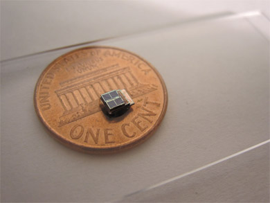 A low-power sensor system developed at the University of Michigan 1,000 times smaller than comparable commercial counterparts. It could enable new biomedical implants. (Photo: Daeyeon Kim.)