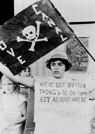 A demonstrator at Love Canal, where town-wide contamination sparked local, then national, anti-toxics protests. (image: Environmental Protection Agency.)
