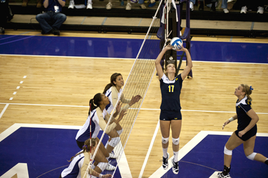 Senior Lexi Zimmerman serves up yet another assist. Though the volleyball team's season ended with a first-round loss in the NCAA tournament, Zimmerman closed her career as U-M's all time assist leader and with three All-America and All-Big Ten titles to her name. (Photo: U-M Photo Services.)