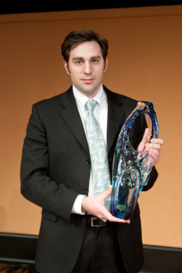 Graduate student Nick Moroz, pictured here with the Clean Energy Prize trophy, led the team of graduate students who invented the new technology. (Photo: U-M Photo Services.)