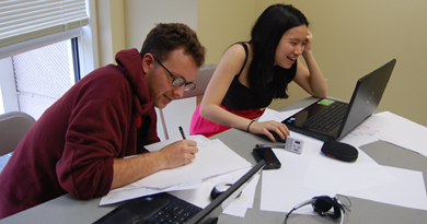 Edmund Zagorin and Maria Liu preparing for a debate. The duo has been U-M's top debate team for the past three years, but 2011 was their year to contend for the national championship. (Photo courtesy Maria Liu.)
