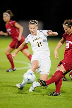 Holly Hein on the soccer field. Coach Greg Ryan says, 'It's impossible to replace a Holly Hein. She just plays too damn hard.' (Photo: U-M Photo Services.) 