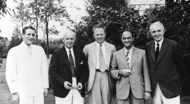 L-R: Samuel Goudsmit, Clarence Yoakum (U-M vice president and dean of Rackham Graduate school), Werner Heisenberg, Enrico Fermi, and Edward H. Kraus (dean of LSA) at the University of Michigan in 1939. Close friends, the world-class physicists were soon on opposite sides of World War Two, and Goudsmit was involved in a proposal to kidnap his friend Heisenberg. (Photo courtesy AIP Emilio Segre Visual Archives, Crane-Randall Collection.) 