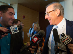 Ross with reporters.
