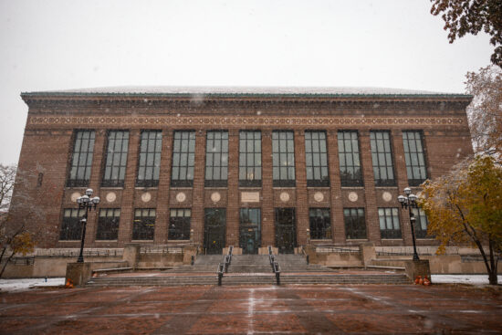 Hatcher Graduate Library looks out over the wet bricks on The Diag during the first snowfall of Fall 2025.