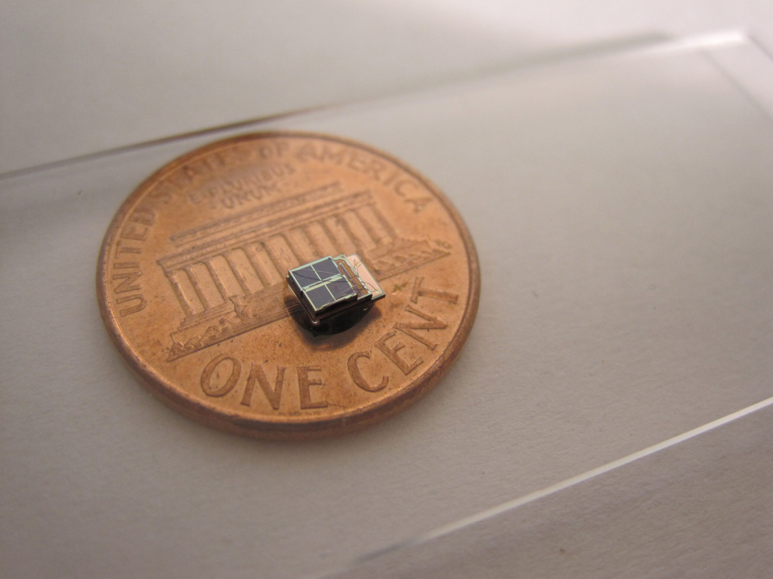 A low-power, sensor system developed at the University of Michigan 1,000 times smaller than comparable commercial counterparts. It could enable new biomedical implants. Photo by: Daeyeon Kim