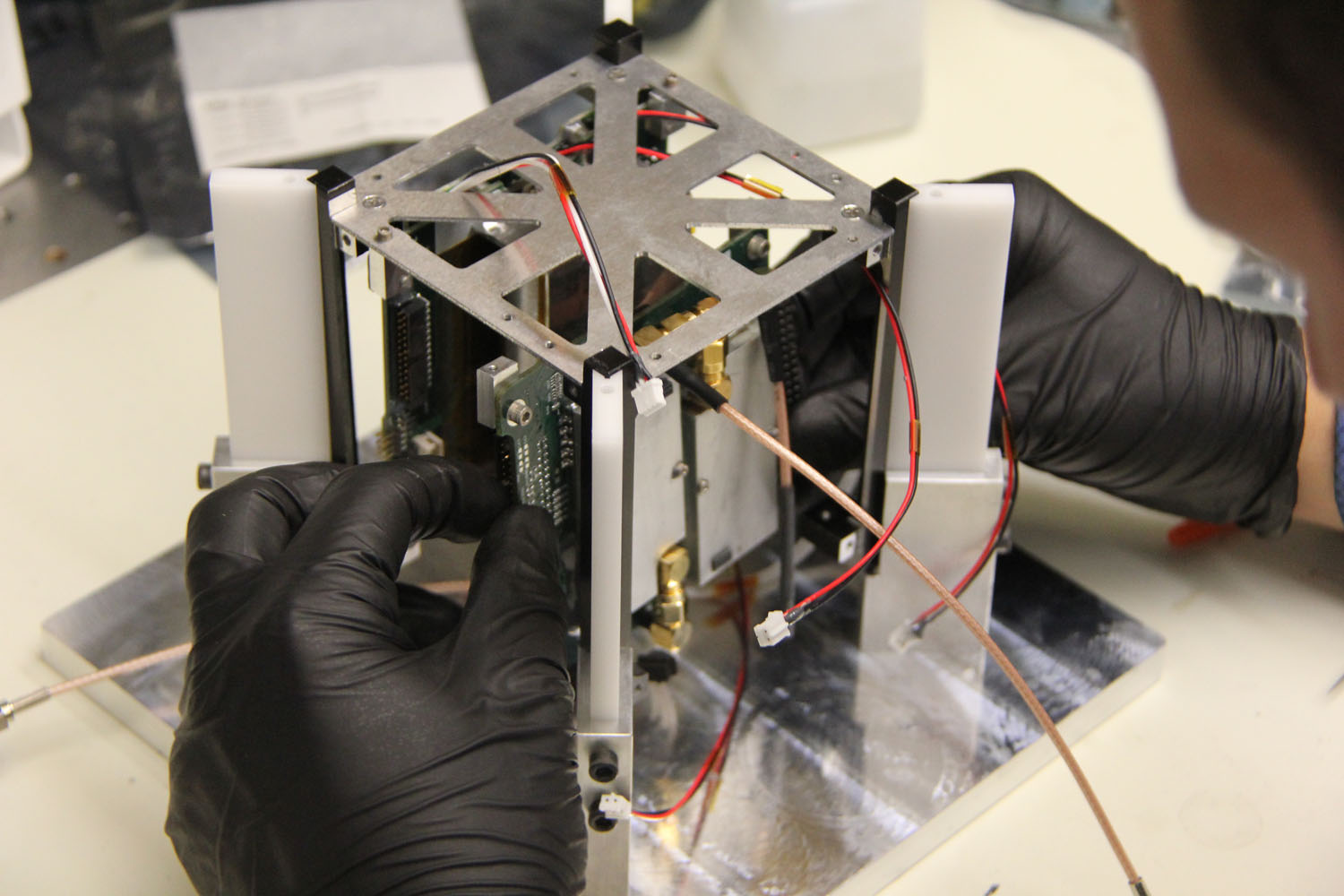 The M-Cubed CubeSat mini-satellite, built by Michigan students, will be used to test high resolution camera hardware for a future NASA Earth science mission. Credit: The Michigan Exploration Lab