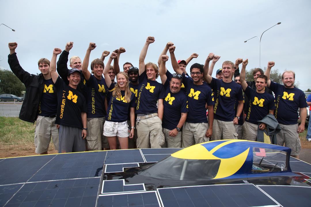 After five days on the road, U-M solar car team members celebrate winning the third place in the World Solar Challenge race across Australia. The end of the timed route was just outside of Adelaide on Thursday, October 20, 2011. It's a bitter-sweet day for the team who have come third in four WSC races before. This year, the team was really hoping to win. Formal crossing of the finish line will be the next day. Photo by Marcin Szczepanski, Multimedia Content Producer/College of Engineering, U-M 