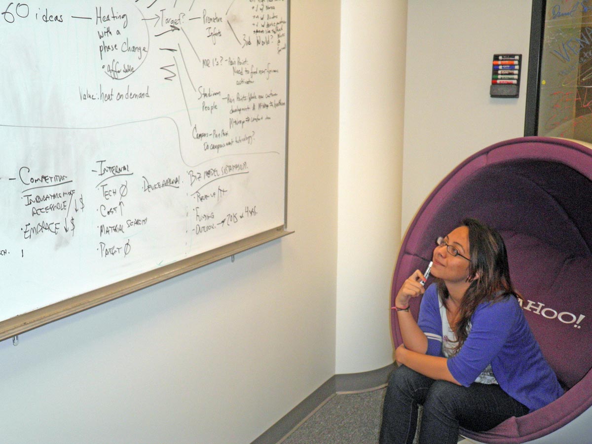 Malvika Bhatia strategizes at the TechArb University of Michigan student business accelerator. Bhatia is a co-founder of the company DIIME, which is working to solve health crises in developing nations. Photo courtesy of Gillian Henker