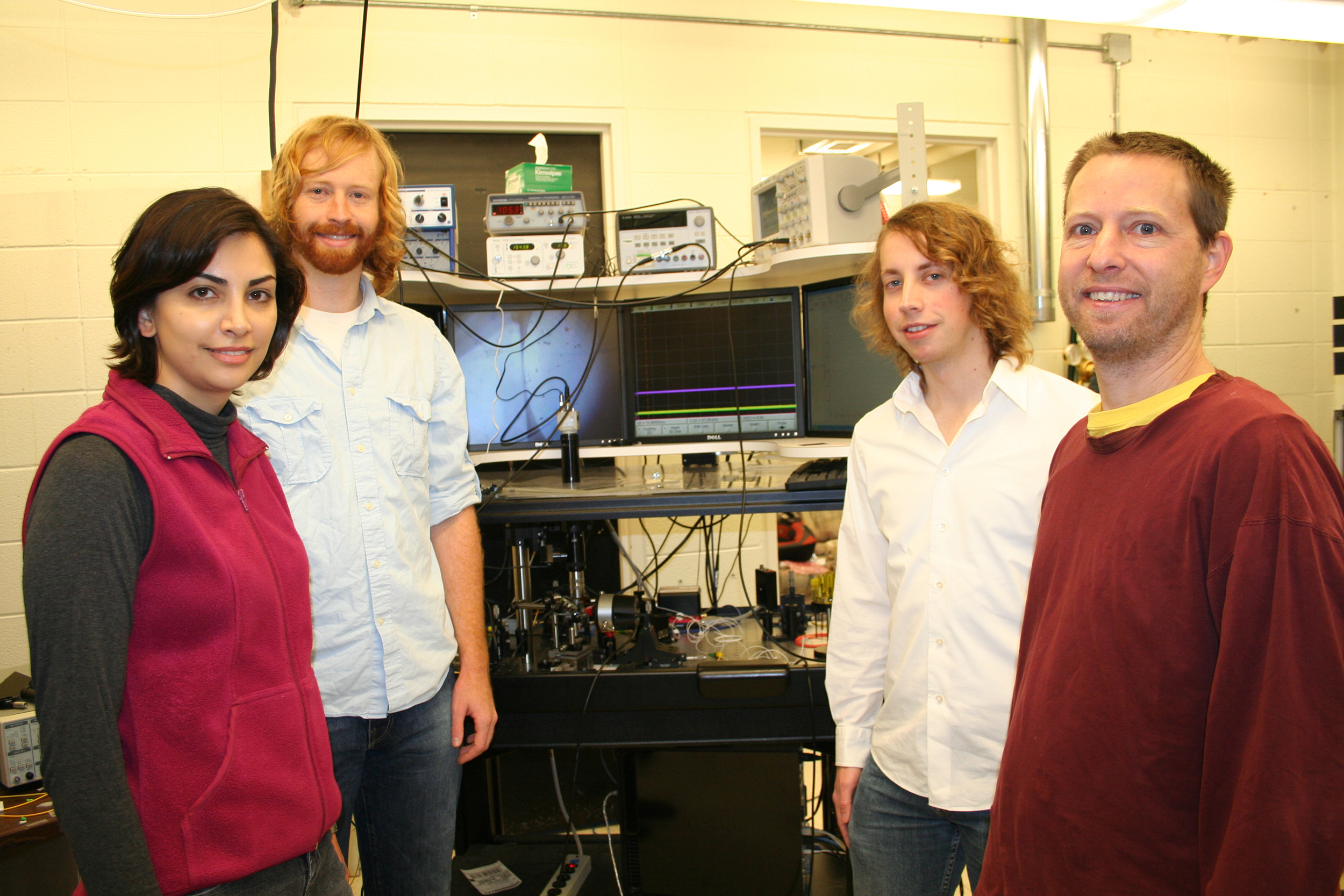 Electrical engineering and computer science researchers assistant professor Mona Jarrahi, doctoral students Jeremy Moore and Matthew Tomes and assistant professor Tal Carmon. Photo courtesy of Mona Jarrahi
