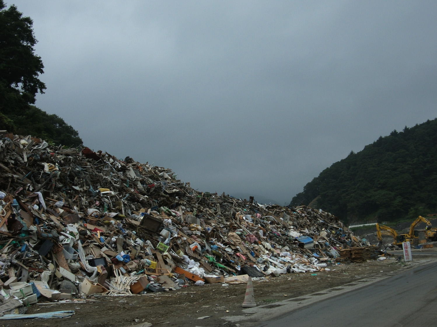 Debris from the tsunami disaster is piled high in a hard-hit coastal town in Miyagi Prefecture.