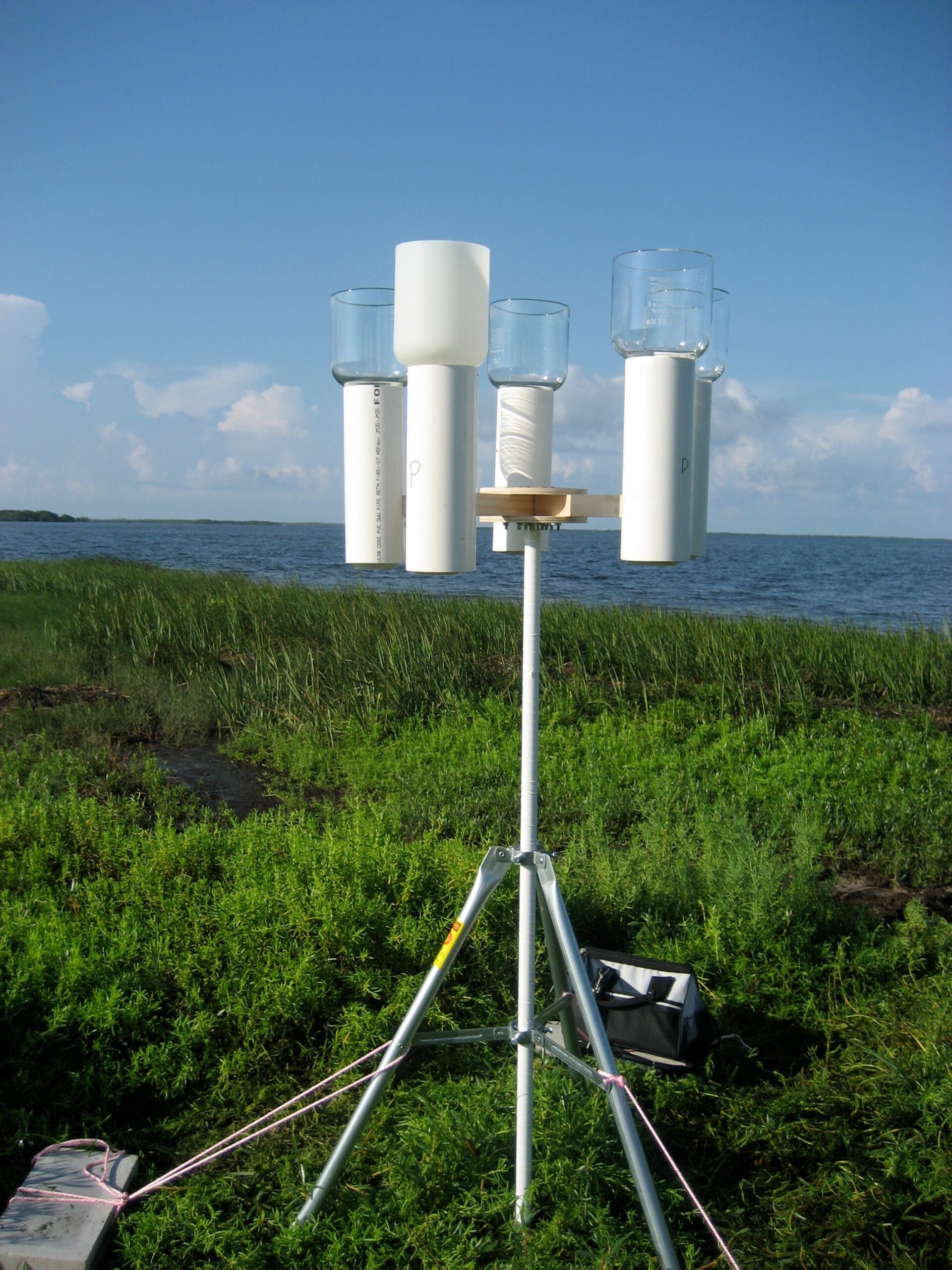Sampling tripod with funnels to collect precipitation.  This study site was located on the Gulf of Mexico coast near Crystal River, Florida. Photo courtesy of Laura Sherman