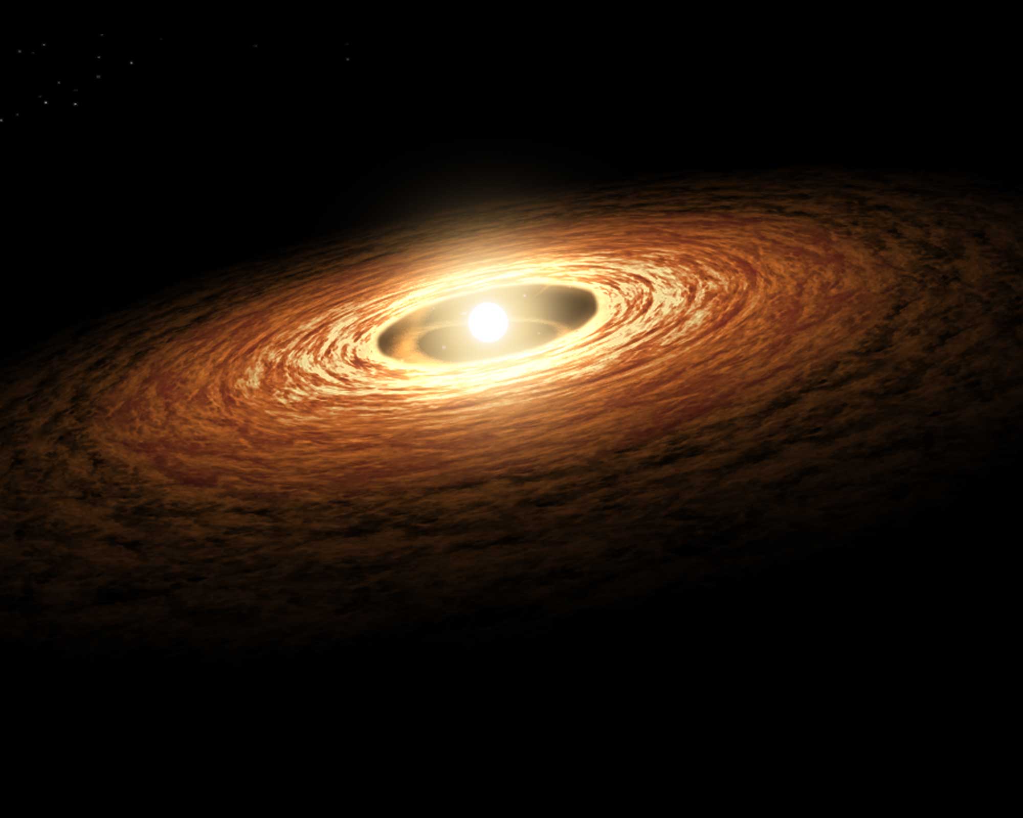 The image shows a young star encircled by its planet-forming disk of gas and dust. An international team of astronomers has just discovered a tight ring of carbon monoxide in the planet-forming disk around V1052 Cen, a star about 700 light years away in the southern constellation Centaurus. Credit: NASA/JPL-Caltech