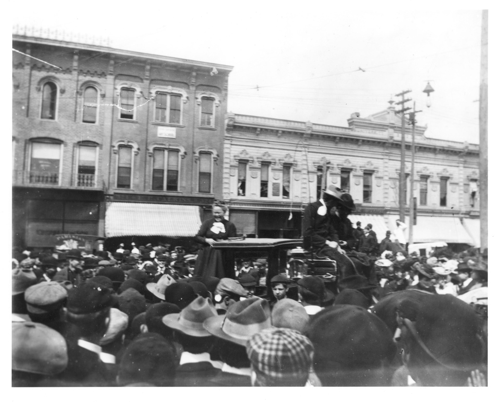 Carrie A. Nation (1846-1911), the "Vessel of Wrath," was 56 and at the peak of her fame on May 3, 1902, when, standing on the back of a horse-drawn cab at the corner of State Street and North University Avenue, she engaged in rollicking repartee with a boisterous crowd of Michigan students. Photo courtesy of U-M Bentley Historical Library.