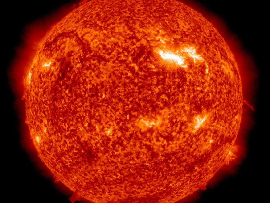 An active region on the sun, seen above as the bright spot to the right, has been moving across the face of the sun from left to right since March 2, 2012. Image credit: NASA/SDO/AIA