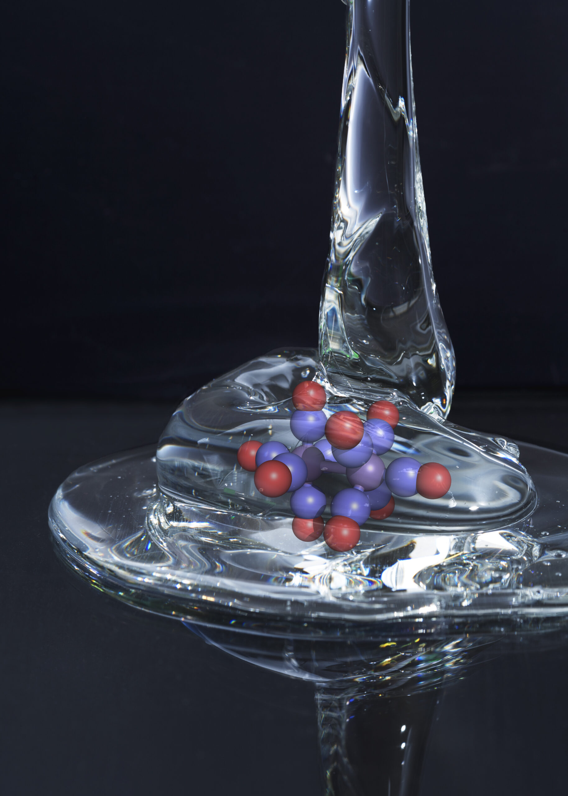 This photo-illustration depicts glass as it appears when it is heated nearly to the "glass transition temperature," when it is simultaneously composed of fluid, flowing regions and solid-like, rigid domains. Image credit: Courtesy of Kevin Kubarych and Matthew Ross