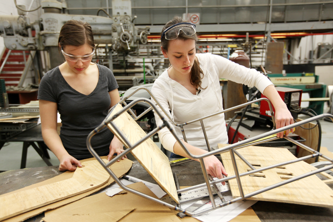 Rachel Strauss (left) and Megan Bland, master's students in biomedical engineering developed an inexpensive, low-tech child car seat for use in developing nations where car seats are not mandated or even commonly used. The car seat one of the more than 100 technologies University of Michigan students have cataloged in a new wiki of medical devices for resource-limited settings. Photo by Marcin Szczepanski