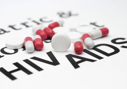 Image of medication on top of words HIV and AIDS (stock image)