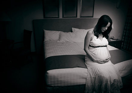 Image depicting a depressed pregnant woman. (stock image)