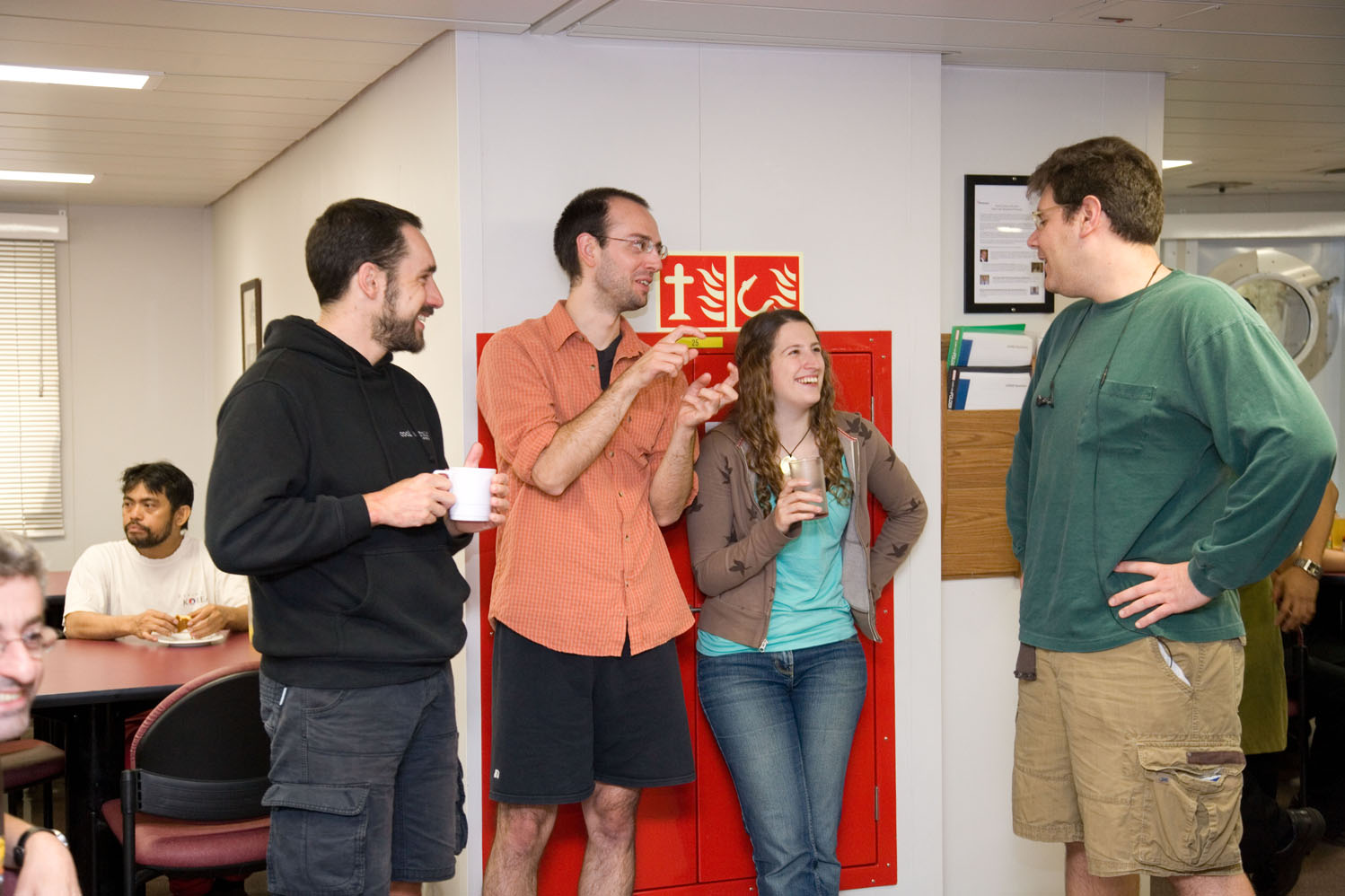 Tom Dunkley Jones (University College London, UK), Thomas Westerhold (University of Bremen, Germany), Kirsty Edgar (National Oceanography Centre, UK), and Howie Scher (University of South Carolina, USA) participate in birthday festivities. Image credit: Integrated Ocean Drilling Program/United Stated Implementing Organization (IODP/USIO)