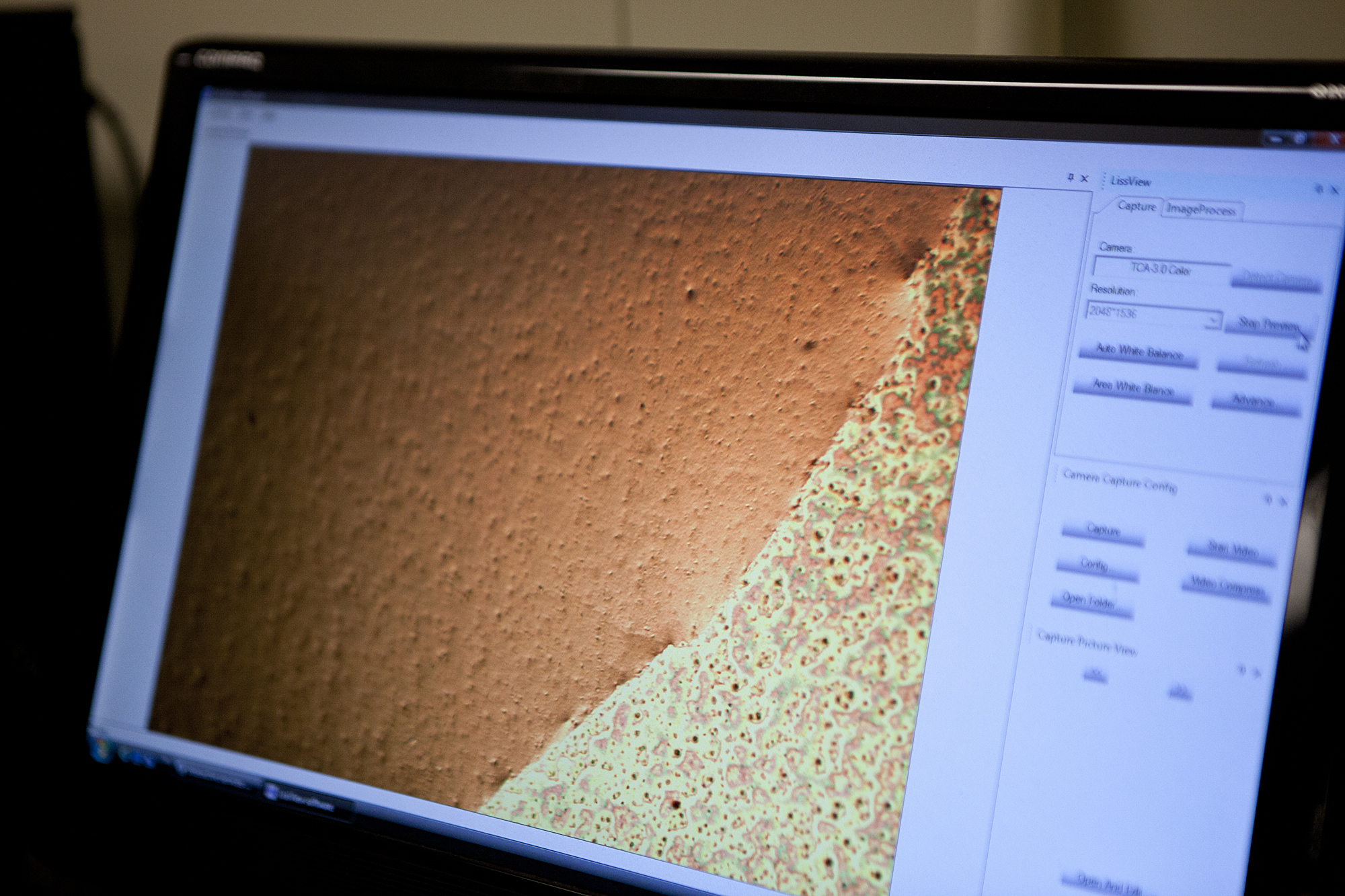 When viewed through a microscope, the surface reconfiguration of the coating becomes apparent. The coating becomes smoother when exposed to water, enabling polymers in the coating to bond with water and pull it through the filter, while oil remains on top. Photo by Laura Rudich