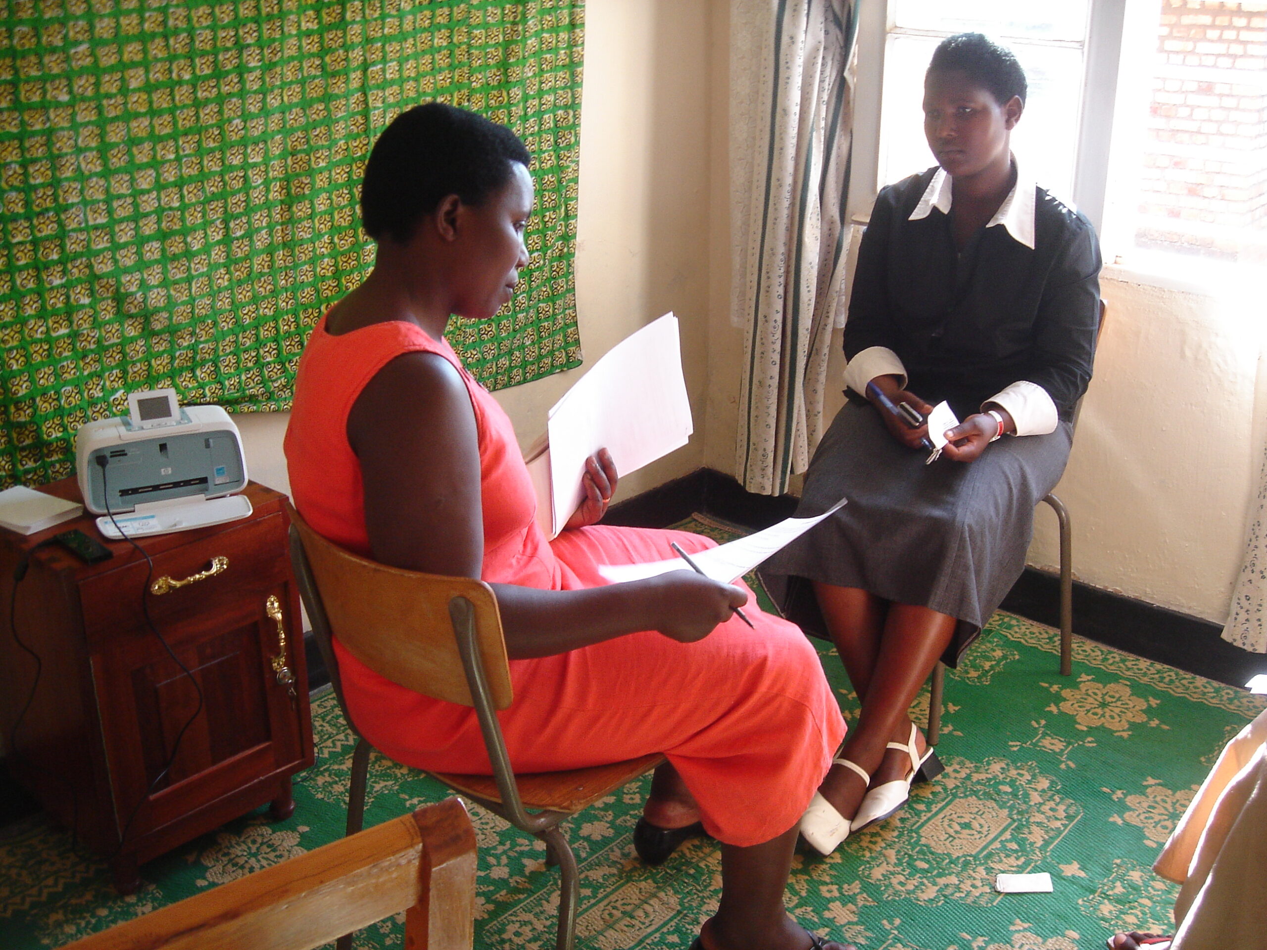 Mukakayange Veronique trains Stories for Hope facilitator Kakuze Josiane. Stories for Hope Rwanda is a storytelling project that brings young people and elders together to talk about the past as a way to break the silence between generations that has fallen since the genocide. Photo Courtesy of Patricia Pasick