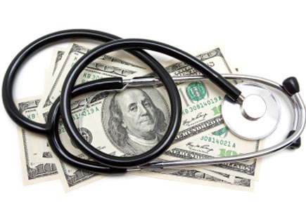 Stethoscope on US Paper Currency isolated on white (stock image)