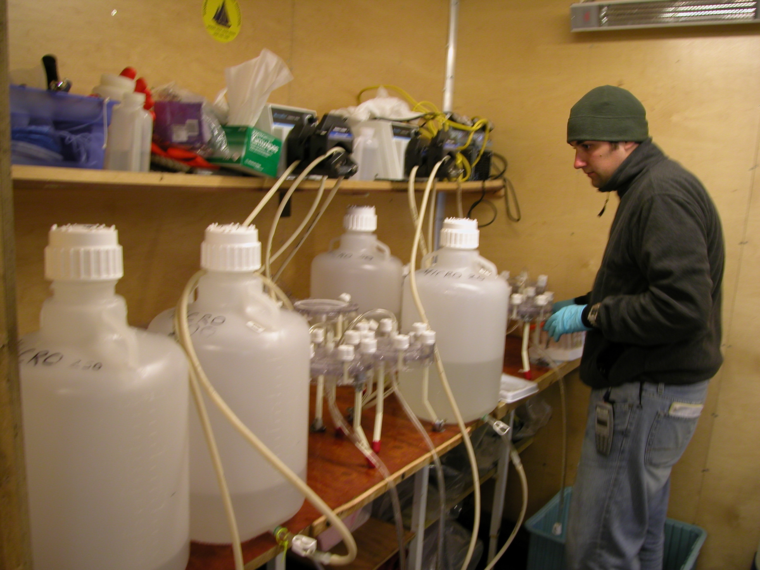U-M graduate student Kevin Bakker in a laboratory aboard the icebreaker Oden. After collecting water samples, Bakker filtered the water to extract microbial DNA, then sent the genetic material to another lab for sequencing. Photo by Patricia Yager.