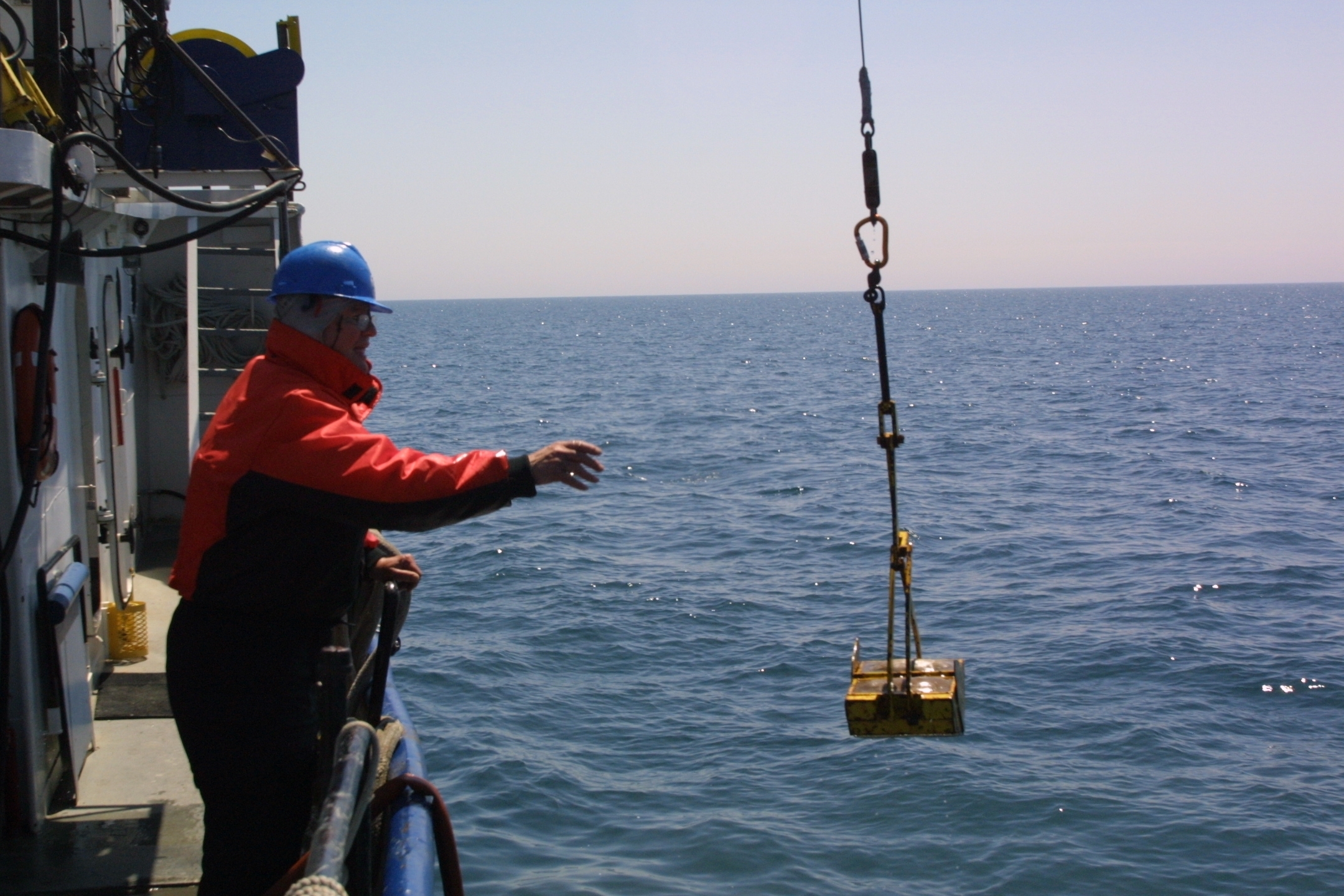 University of Michigan researcher David Jude collecting samples on Lake Michigan in 2009, during a study of quagga mussels. Photo by Jim Erickson