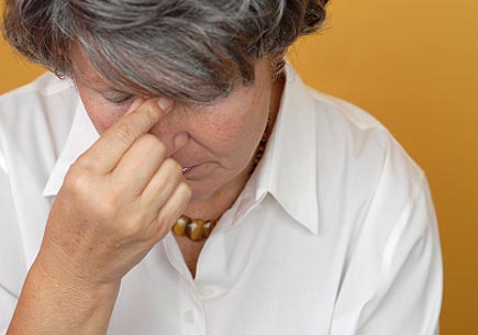 Sad and depressed older woman in pain. Image credit: iStock
