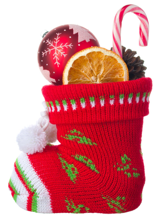 Christmas stocking stuffed with ball, orange and a candy (stock image)