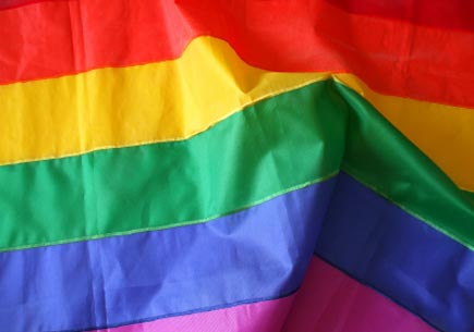 Detail of the rainbow (gay) flag, with folds and creases. (stock image)