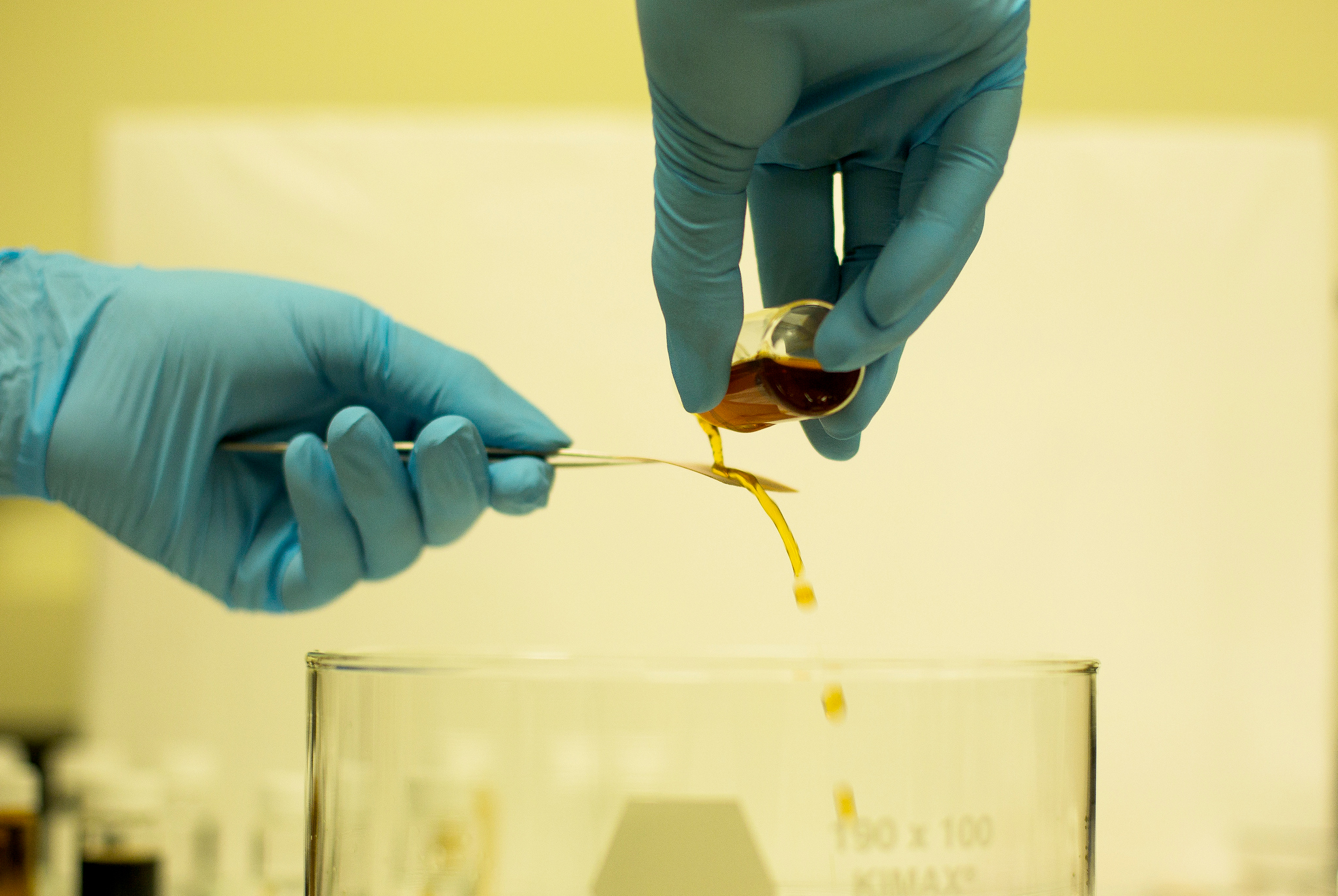 A new coating developed at the University of Michigan can repel virtually any liquid and could lead to breathable protective wear for soldiers and scientists, as well as stain-proof garments. In this demonstration, it repels coffee. Image credit: Joseph Xu, Michigan Engineering Communications & Marketing