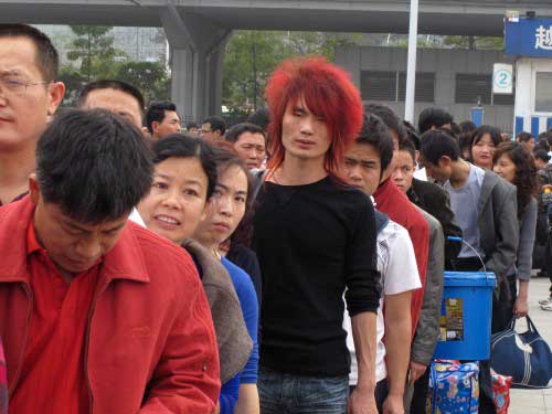 Chinese migrant laborers at the train station in Guangzhou, one of China's most important manufacturing centers. Image credit: William Foreman