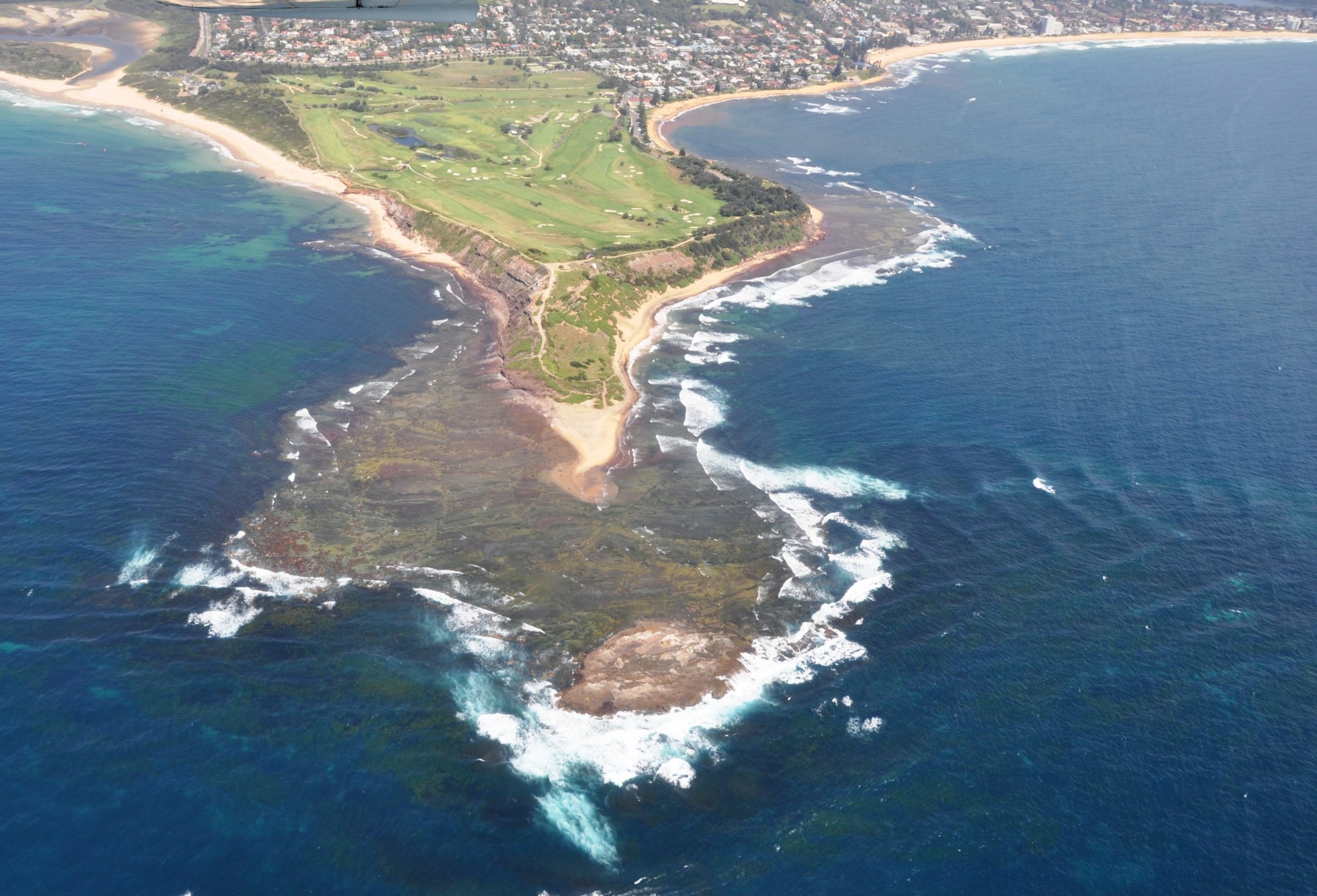 An aerial view of the rocky southern Australia coastline near Sydney. This location was part of a decade-long study of clam evolution led by two University of Michigan biologists. Photo by Peter Donkers.