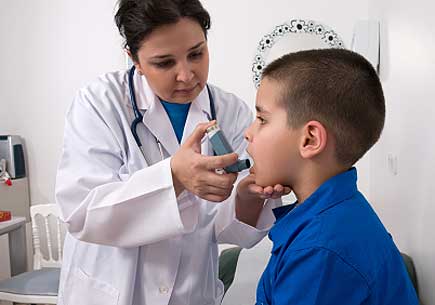 Female doctor applying oxygen treatment on asthmatic child. (stock image)