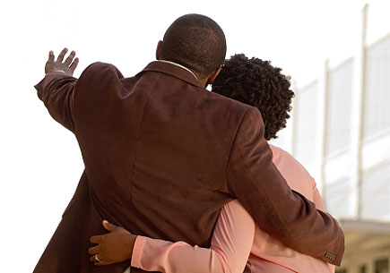 Photo of a couple embracing and discussion the future. (stock image)