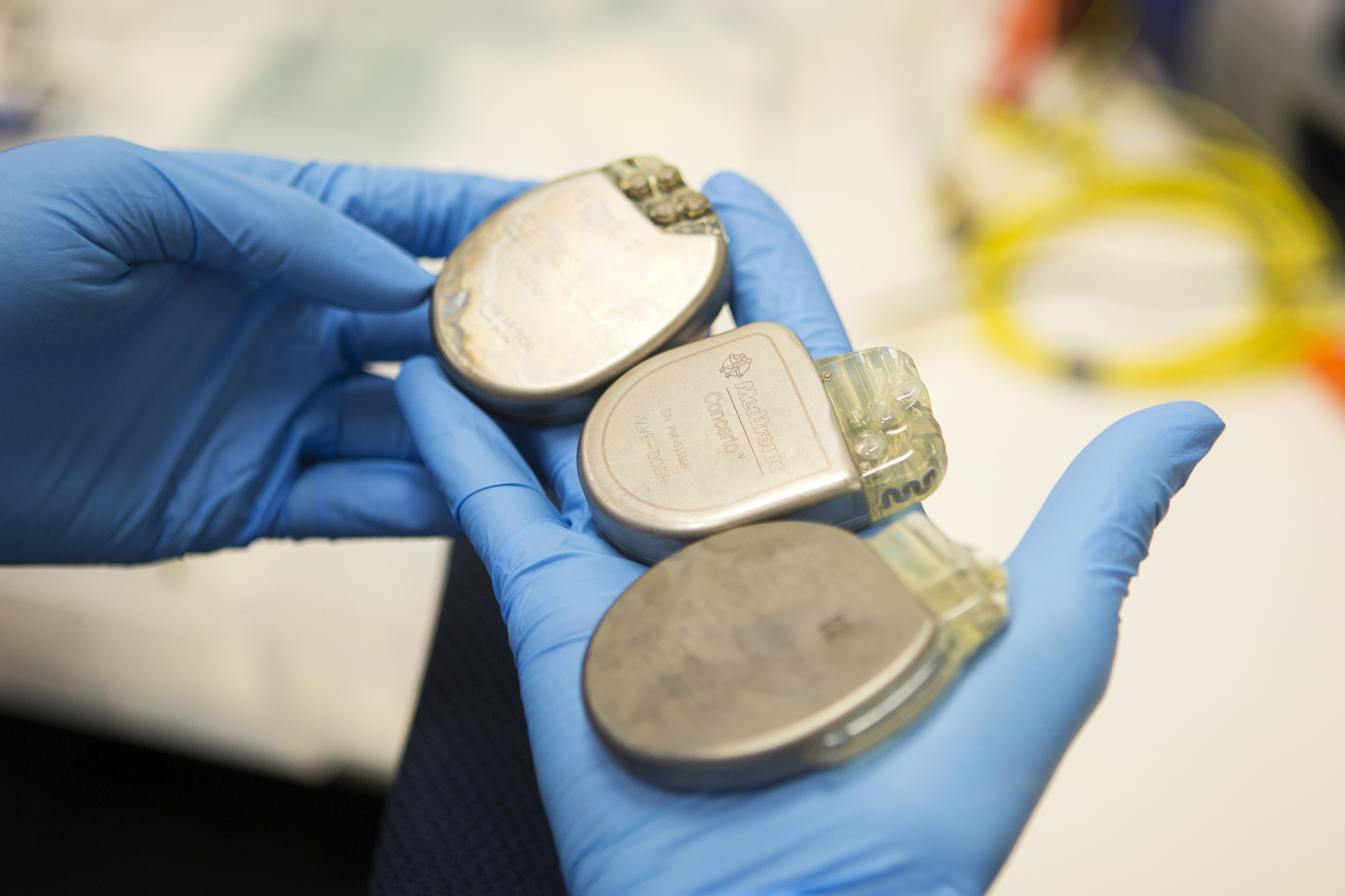 Kevin Fu, EECS Professor, holds a three pacemakers in hand that are tested and used by his research group in the Beyster Building on May 8, 2013.  Fu leads a research group, The Security and Privacy (SPQR) Lab, that tests security and privacy of various medical devices, including heart rate sensors, pacemakers, defibrillators, drug delivery systems, and neurostimulators.  Photo: Joseph Xu, Michigan Engineering Communications & Marketing