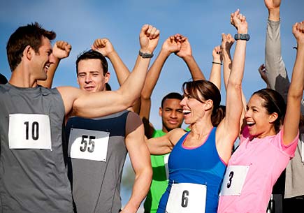 A group of runners celebrates. (stock image)