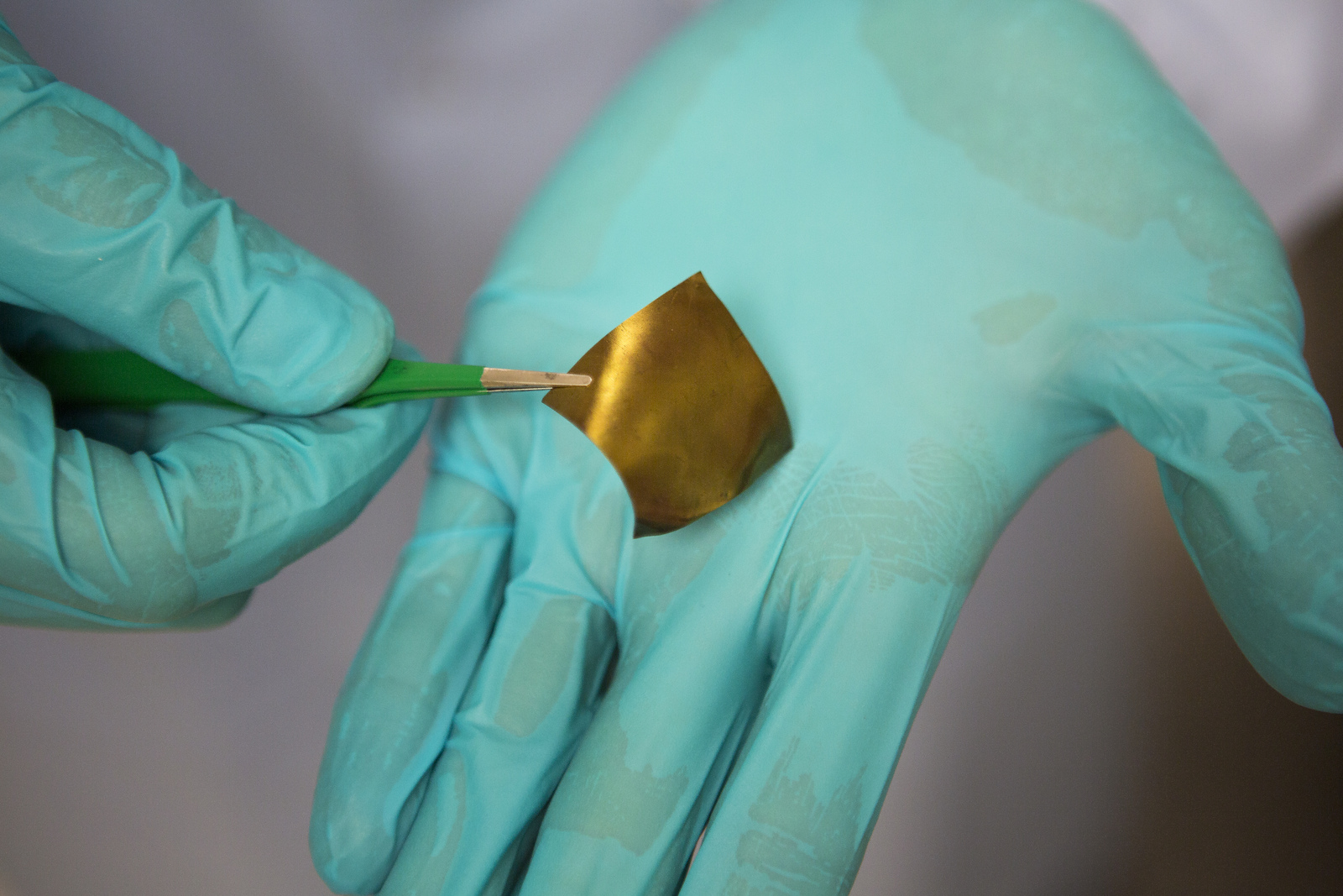 Polyurethane studded with gold nanoparticles can conduct electricity even when stretched to more than twice its original length. Stretchable electrodes pave the way for flexible electronics and gentler medical devices. Image credit: Joseph Xu