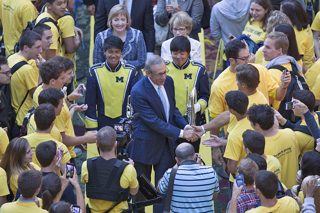 Ross shakes hands with students gathered this morning to celebrate the gift. Image credit: Michigan Photography