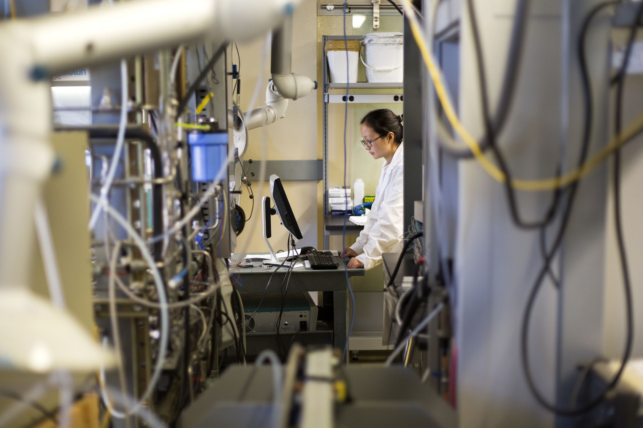 Xingyi Yang, ChE Research Fellow, tests a battery cell in the Phoenix Memorial Laboratory. Image credit: Joseph Xu, Michigan Engineering Communications & Marketing