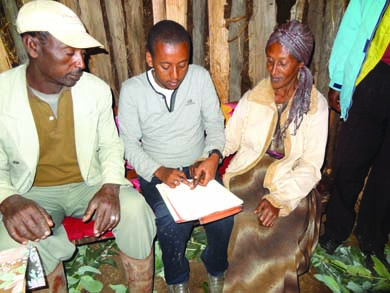 Feleke's family signs paperwork.