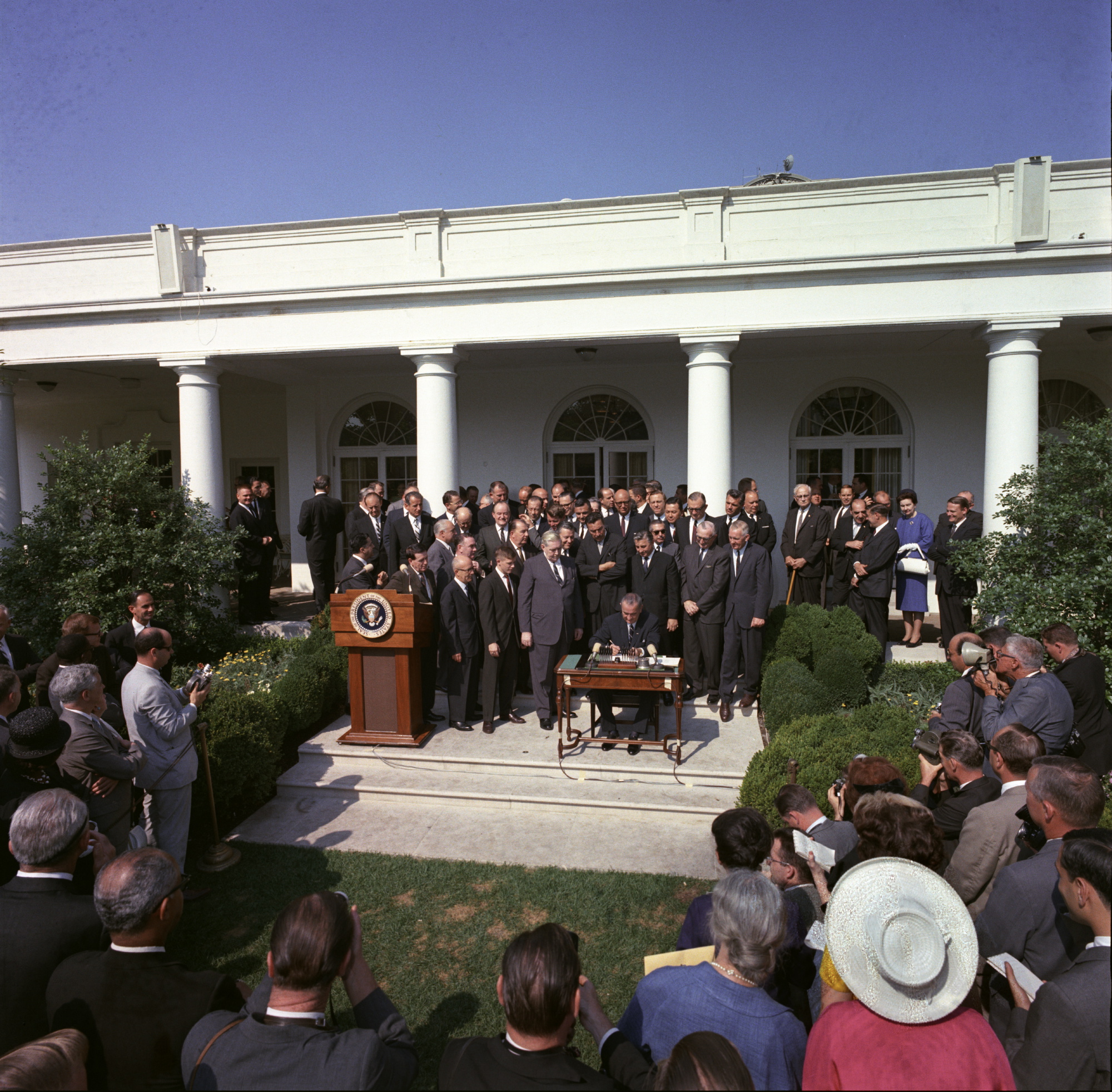 President Johnson signing the Economic Opportunity Act of 1964. (public domain image)