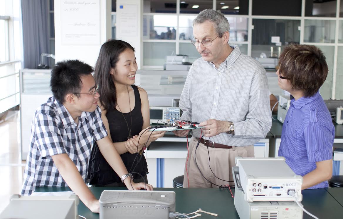 Students at the Joint Institute consult with Olivier Bauchau, associate dean and professor, about projects.