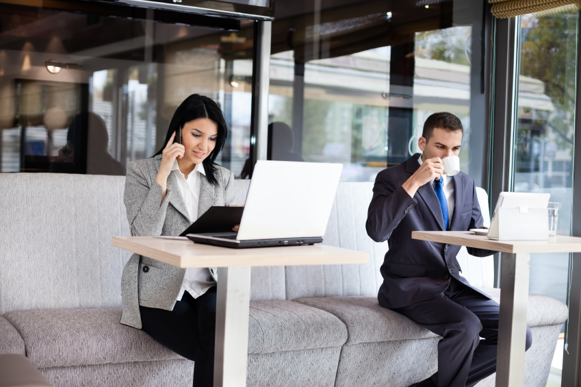 Busy business people in cafe. (stock image)