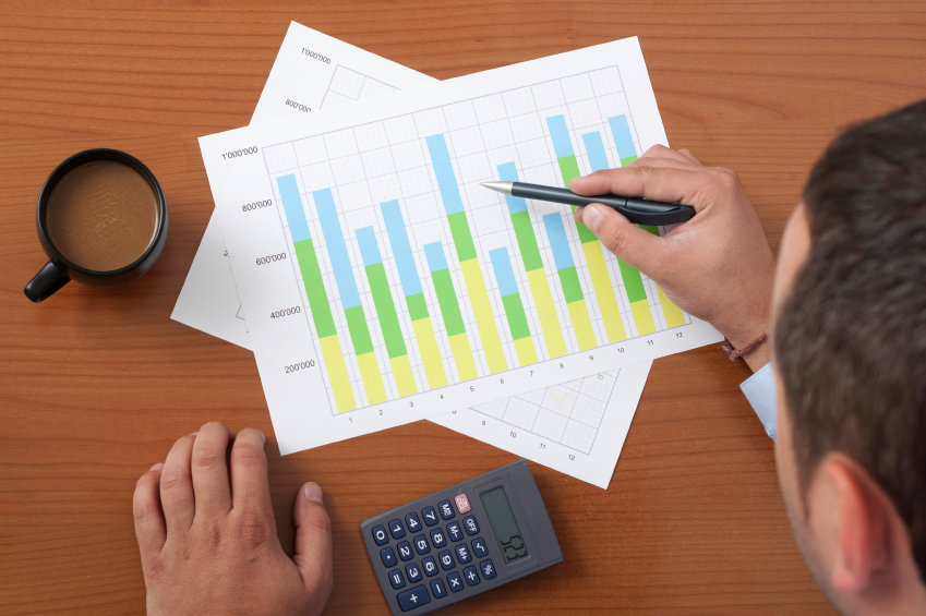 Businessman analyzing a data chart. (stock image)